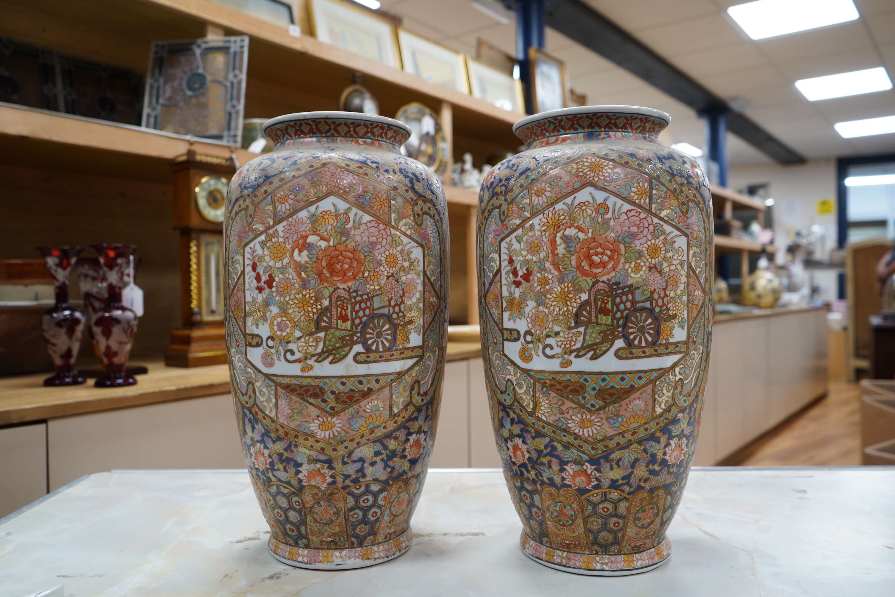 A pair of early 20th century Japanese satsuma pottery vases, 37cm high